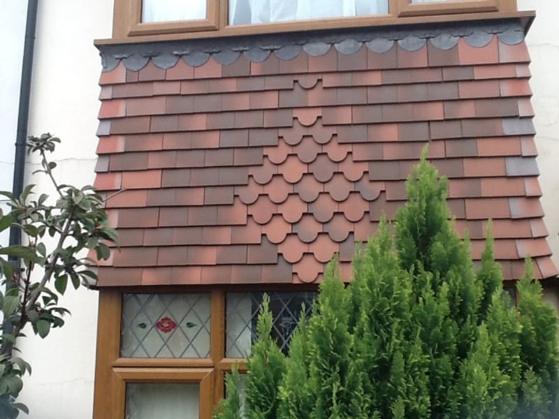 Decorative tiled dormer roof detail in Gloucestershire